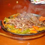 Sizzling Platter of Mexican Food from Nacho Mamas Marco Island FL